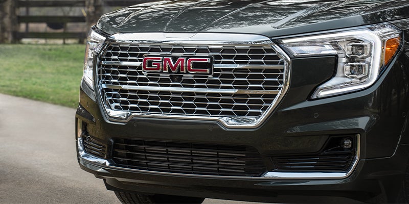 Close-up of the front chrome grille and headlight of GMC Terrain