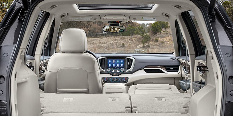Spacious light-colored leather interior and cargo area of a 2024 GMC Terrain.