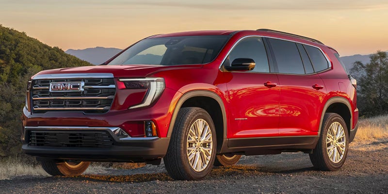 Red GMC Acadia front.